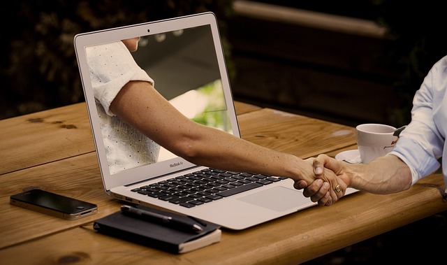 online learning interaction. hand through computer